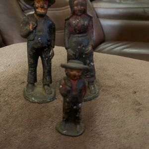 Vintage cast iron Figurine Set depicting an Amish family.